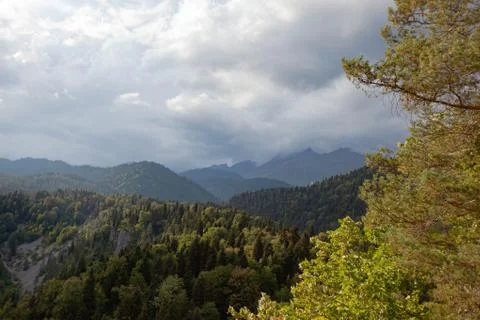 Mountain peaks in the clouds Stock Photos