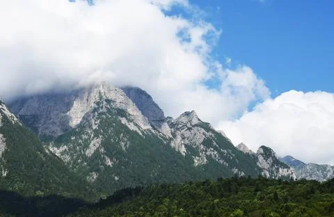 Mountain peaks covered by clouds Stock Photos