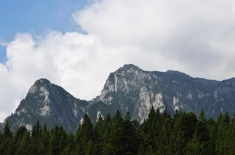 Mountain peaks covered by clouds Stock Photos