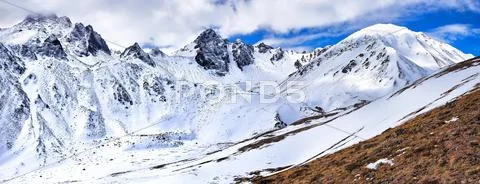 Mountain peaks of Eastern Sayan at end of April Stock Photos
