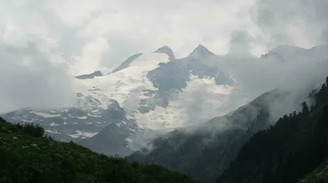 Mountain peaks of high tauern in cloudscape Video stock 67756605