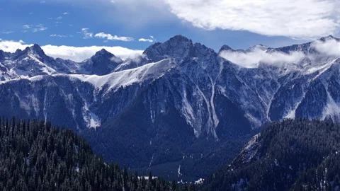 Mountain Peaks With Low Clouds Above Winter Forest Aerial View Stock Footage 325651290