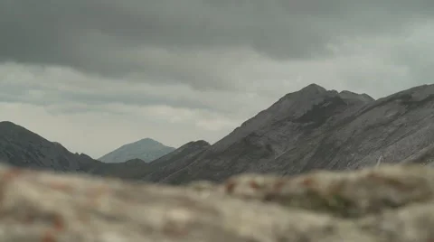Mountain Peaks to Low Rock Focus 4K Stock Footage 67478156