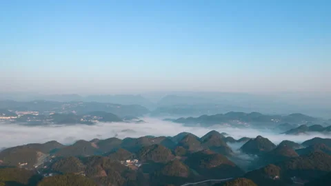 Mountain Peaks Sea of Clouds Above Aerial Timelapse Stock Footage 320880628