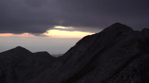 Mountain Peaks at Sunset Pan 4K Stock Footage 67478412