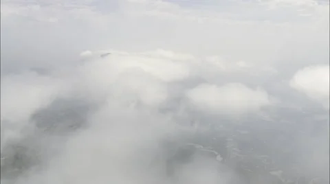 Mountain peaks through thick clouds Stock Footage 66826050
