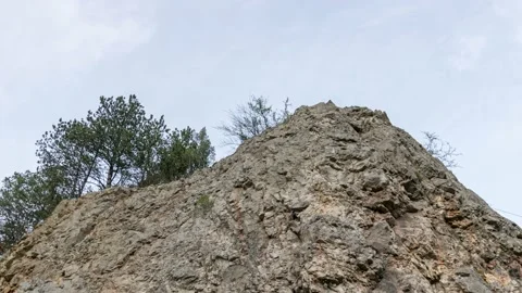 Mountain peek against cloudy sky Stock Footage 224530733