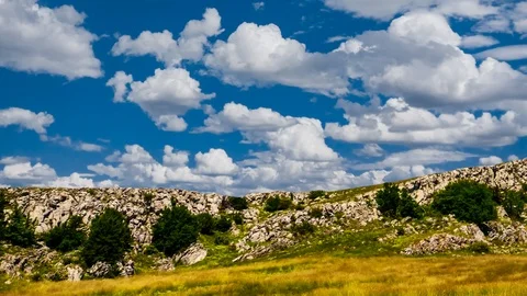 Mountain plateau under a cloudy sky time lapse scene Stock Footage 102221099