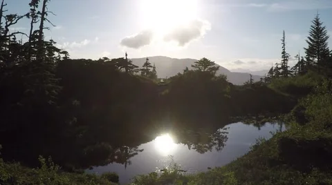 Mountain Pond With Sun Reflection &amp; Hiking Trail Stock Footage 51307952
