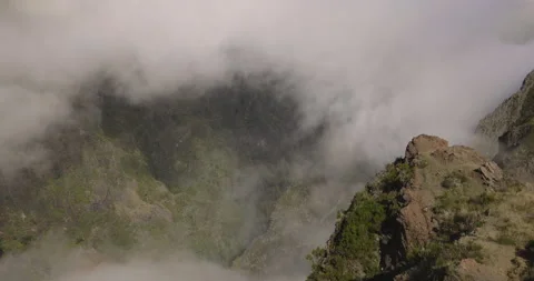Mountain precipice and flowing clouds, 4K Stock Footage 246367664