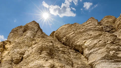Mountain precipice in a rays of sun time lapse scene 스톡 동영상 252131261