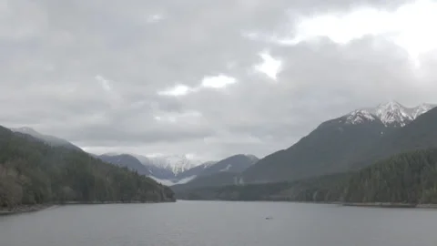 Mountain Range Above Lake, Cloudy Sky - Wide Shot 스톡 동영상 219530370