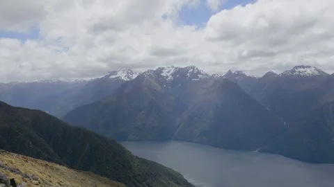 Mountain range above lake Stock Footage 327764617