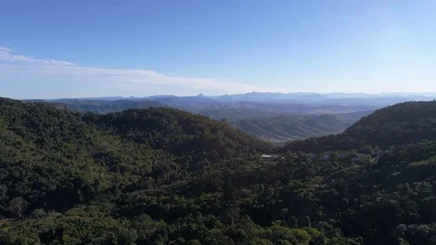 Mountain range aerial reveal by drone with villa Stock Footage 77491896