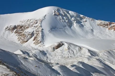 Mountain range after fresh snowfall in the mountains of Tien-Shan Stock Photos