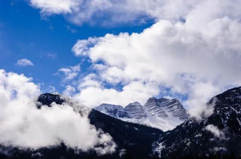 Mountain range among clouds and fog. Stock Photos