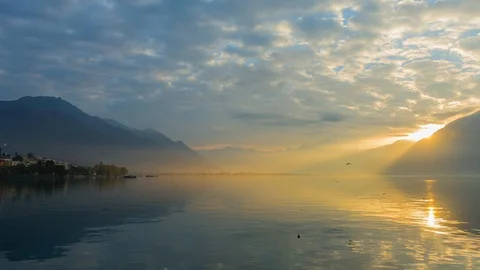 Mountain Range and Alpine Lake Maggiore in Sunset with Cloudscape 動画素材 127152946