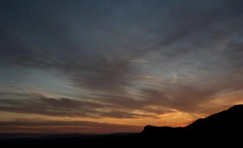 Mountain range and dramatic sky during sunset Stockfoto's