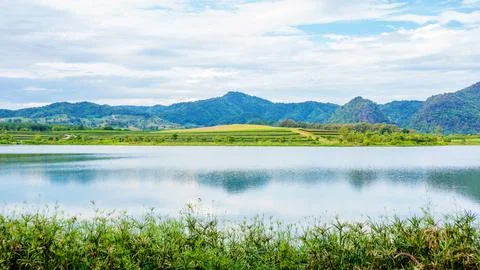 Mountain range and lake at Singha park Chiang rai, Thailand. Stock Photos