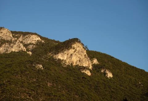 Mountain range and steet face and blue sky Stock Photos