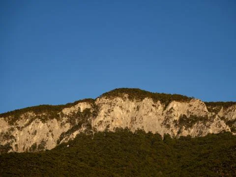 Mountain range and steet face and blue sky Stock Photos