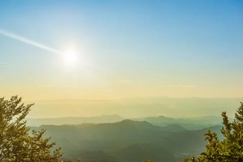 Mountain range and sun Stock Photos