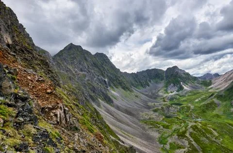 Mountain range and upper valley below Stock Photos