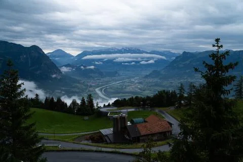 A mountain range and a valley in the clouds - blue colors Stock Photos