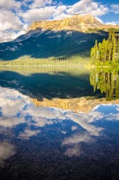 Mountain range and water reflection, emerald lake, canada Stock Photos