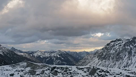 Mountain Range Austria Tyrol Alps Snow and dramatic clouds, view into the valley Stock Footage 168790521