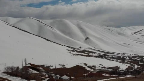 The mountain range is blanketed in snow except for one, stock footage. Stock Footage 304866446