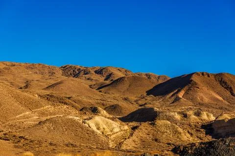 A mountain range with a blue sky in the background Foto stock