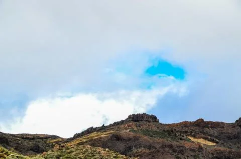 A mountain range with a blue sky in the background Stock-Fotos
