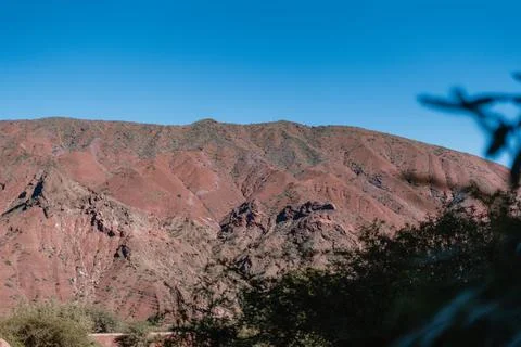 A mountain range with a blue sky in the background Foto stock