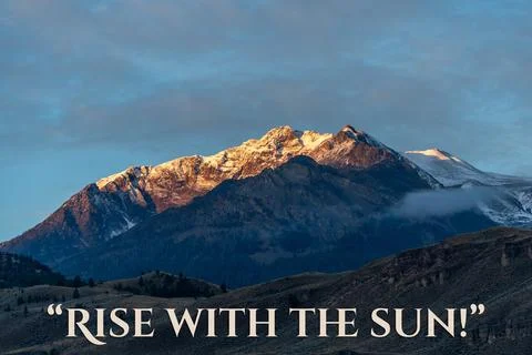 A mountain range with a bright sun shining on it Stock Photos