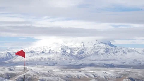 Mountain range of the Caucasus mountains in the distance with a view of Elbrus Stock Footage 154338916