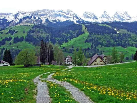 Mountain range Churfirsten in early spring; between valleys Thurtal and Seeztal Stock Photos