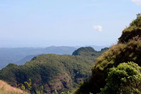 A mountain range with a clear blue sky in the background Stock Photos