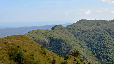 A mountain range with a clear blue sky in the background Stock Photos