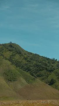 A mountain range with a clear blue sky in the background Stock Photos