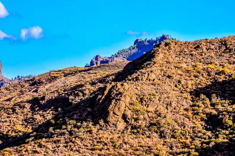 A mountain range with a clear blue sky Stock Photos