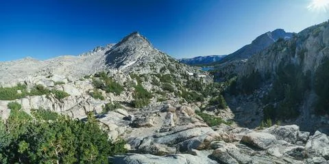 A mountain range with a clear blue sky in the background Foto stock