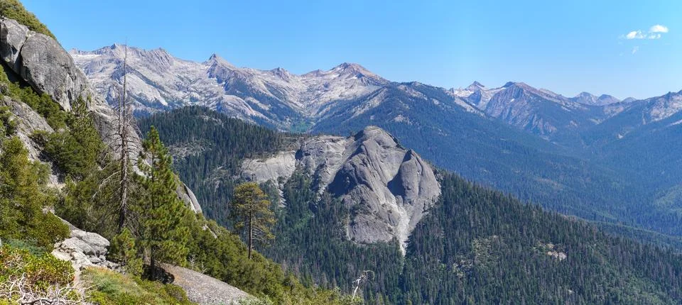 A mountain range with a clear blue sky in the background Stock Photos