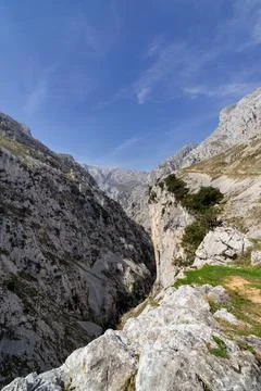 A mountain range with a clear blue sky Stock Photos