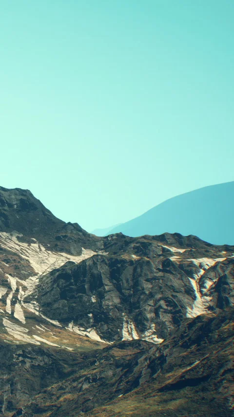 Mountain range with clear sky and distant hills during daytime Stock Footage 341027481