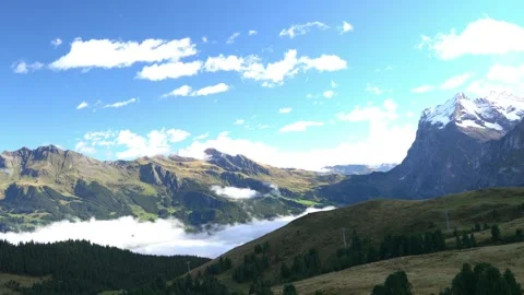 A mountain range with a cloudy sky in the background Stock Footage 313555438