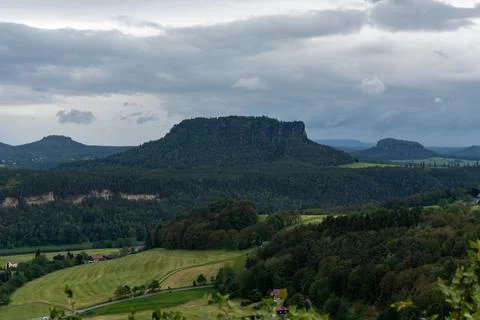 A mountain range with a cloudy sky in the background Stock Photos