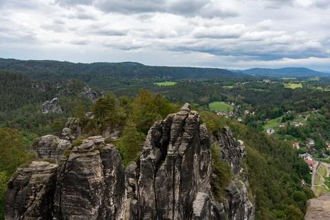 A mountain range with a cloudy sky in the background Stock Photos