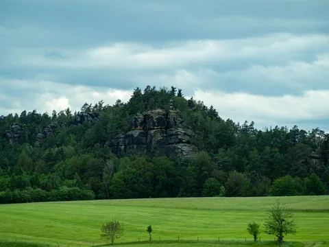 A mountain range with a cloudy sky in the background Stock Photos