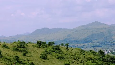 A mountain range with a cloudy sky in the background Stock Photos